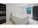 Cozy bedroom with a full bed, a window with blinds, and custom closet and shelving units at 770 Spalding Heights Dr, Atlanta, GA 30350