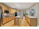 Bright, modern kitchen featuring stainless steel appliances, custom cabinets, an island, and adjacent dining area at 770 Spalding Heights Dr, Atlanta, GA 30350