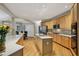 Bright kitchen with an island, stainless steel appliances, hardwood floors, and ample cabinet space for storage at 770 Spalding Heights Dr, Atlanta, GA 30350