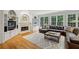 Spacious living room with a fireplace, built-in shelving, and comfortable seating perfect for entertaining guests at 770 Spalding Heights Dr, Atlanta, GA 30350
