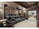 Home theater with comfortable seating, a projector, and a large screen for entertainment at 770 Spalding Heights Dr, Atlanta, GA 30350