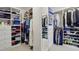 Spacious walk-in closet with custom shelving and ample storage for clothes, shoes, and accessories at 770 Spalding Heights Dr, Atlanta, GA 30350