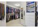 Well-organized walk-in closet with custom shelving, hanging rods, and drawers for optimal storage at 770 Spalding Heights Dr, Atlanta, GA 30350