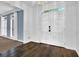 Inviting foyer with hardwood floors, white trim, and a grand double-door entryway at 140 Ashewoode Downs Ln, Johns Creek, GA 30005