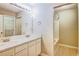Bathroom with double vanity, large mirror, and shower-tub combo with tile surround at 1643 Jackson Nw Way, Atlanta, GA 30318