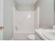 Bathroom featuring a shower-tub combo with white tiling and neutral walls at 1643 Jackson Nw Way, Atlanta, GA 30318
