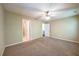 Bedroom featuring beige carpet, neutral walls, and a ceiling fan at 1643 Jackson Nw Way, Atlanta, GA 30318