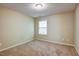 Bedroom featuring beige carpet, neutral walls, and a ceiling light at 1643 Jackson Nw Way, Atlanta, GA 30318