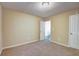 Bedroom featuring beige carpet, neutral walls, and a ceiling light at 1643 Jackson Nw Way, Atlanta, GA 30318