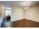 Bright dining room with modern light fixture and hardwood floors at 1643 Jackson Nw Way, Atlanta, GA 30318