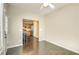 Bright dining area with hardwood floors and view into the kitchen, ceiling fan, and neutral walls at 1643 Jackson Nw Way, Atlanta, GA 30318