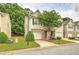 Charming townhome features a well-manicured lawn, a one-car garage, and inviting curb appeal at 1643 Jackson Nw Way, Atlanta, GA 30318