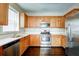 Modern kitchen boasts stainless steel appliances, ample cabinet space, and quartz countertops at 1643 Jackson Nw Way, Atlanta, GA 30318