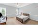 Bedroom with carpet, desk, and a bed with a decorative throw blanket at 390 Wilde Green Dr, Roswell, GA 30075