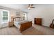 Bedroom with neutral colored walls, carpet, and a wooden bed frame at 390 Wilde Green Dr, Roswell, GA 30075