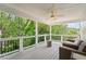 Covered deck with comfortable seating, providing a peaceful outdoor living space at 390 Wilde Green Dr, Roswell, GA 30075
