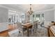 Elegant dining room featuring hardwood floors, chandelier and natural lighting at 390 Wilde Green Dr, Roswell, GA 30075