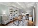 Charming home office with built-in shelving, coffered ceiling and neutral decor at 390 Wilde Green Dr, Roswell, GA 30075