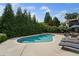Backyard swimming pool with patio and lounge chairs at 390 Wilde Green Dr, Roswell, GA 30075