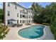 Inviting backyard pool with lounge area and well-maintained landscaping at 390 Wilde Green Dr, Roswell, GA 30075