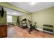 Home gym with various exercise equipment and wood-look flooring at 390 Wilde Green Dr, Roswell, GA 30075