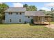Exterior view of home showing the deck and backyard with recently cut grass at 58 6Th W Ave, Dallas, GA 30157