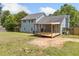 Exterior view of house with large backyard and newly constructed deck at 58 6Th W Ave, Dallas, GA 30157