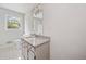 Bathroom with a granite countertop vanity, and a white tiled floor at 58 6Th W Ave, Dallas, GA 30157