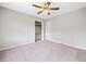 Inviting bedroom featuring neutral carpet, a ceiling fan, and closet with bi-fold doors at 58 6Th W Ave, Dallas, GA 30157