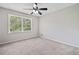 Bright bedroom featuring a ceiling fan and a window with wood blinds for plenty of natural light at 58 6Th W Ave, Dallas, GA 30157