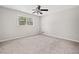 Bedroom with a carpet floor, fan, and window for natural light at 58 6Th W Ave, Dallas, GA 30157