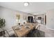 Dining room with a rustic wooden table, stylish chairs, and natural light at 58 6Th W Ave, Dallas, GA 30157