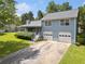 Charming two-story home with a well-manicured lawn and a two-car garage at 58 6Th W Ave, Dallas, GA 30157