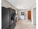 Bright kitchen with stainless steel refrigerator and neutral flooring at 58 6Th W Ave, Dallas, GA 30157