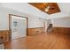 Spacious living room featuring hardwood floors, a ceiling fan, and stairs to the upper level at 58 6Th W Ave, Dallas, GA 30157