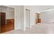 A sunlit living room with hardwood and tile flooring and wood paneling at 58 6Th W Ave, Dallas, GA 30157