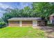 Backyard features a brick exterior, a chimney and an expansive yard, offering privacy and plenty of space for outdoor activities at 4337 Brookside Dr, Forest Park, GA 30297
