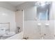 This bathroom features a shower/tub combo, tile wall, toilet, and a mirror at 4337 Brookside Dr, Forest Park, GA 30297