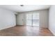 Bright bedroom features wood floors, neutral paint, closet, and a large window letting in plenty of natural light at 4337 Brookside Dr, Forest Park, GA 30297