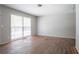 Bright bedroom features wood floors and a large window letting in natural light at 4337 Brookside Dr, Forest Park, GA 30297