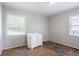 This bedroom features wood floors, a vanity and natural light at 4337 Brookside Dr, Forest Park, GA 30297