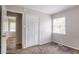 Bedroom features a closet, neutral walls, a window with blinds, and a white door at 4337 Brookside Dr, Forest Park, GA 30297
