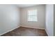 This bedroom features wood floors and a window letting in natural light at 4337 Brookside Dr, Forest Park, GA 30297