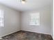 This bedroom features two windows with blinds, neutral walls, and a ceiling light at 4337 Brookside Dr, Forest Park, GA 30297