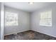 This bedroom features two windows with blinds, neutral walls, and a ceiling light at 4337 Brookside Dr, Forest Park, GA 30297