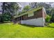 Quaint brick home featuring a well-manicured lawn and a welcoming entrance with steps leading to the front door at 4337 Brookside Dr, Forest Park, GA 30297