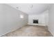 Unfinished living room with white brick fireplace and light gray paneled walls, awaiting personalization and design at 4337 Brookside Dr, Forest Park, GA 30297