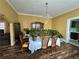 Dining room with a large window, chandelier, and decorative plants at 472 Parkway Ne Dr, Atlanta, GA 30308