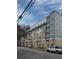 Modern apartment building featuring a brick facade, neutral tones, and numerous windows at 472 Parkway Ne Dr, Atlanta, GA 30308