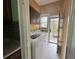 Laundry room featuring a side-by-side washer and dryer setup with cabinetry at 472 Parkway Ne Dr, Atlanta, GA 30308